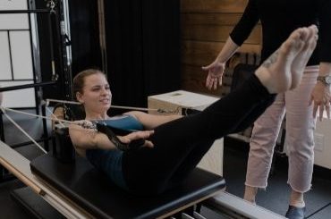 Patient doing Stott Pilates V2 Max Plus™ Reformer at Pure Movement Physiotherapy & Aquatic Rehab Stittsville, Kanata Ontario